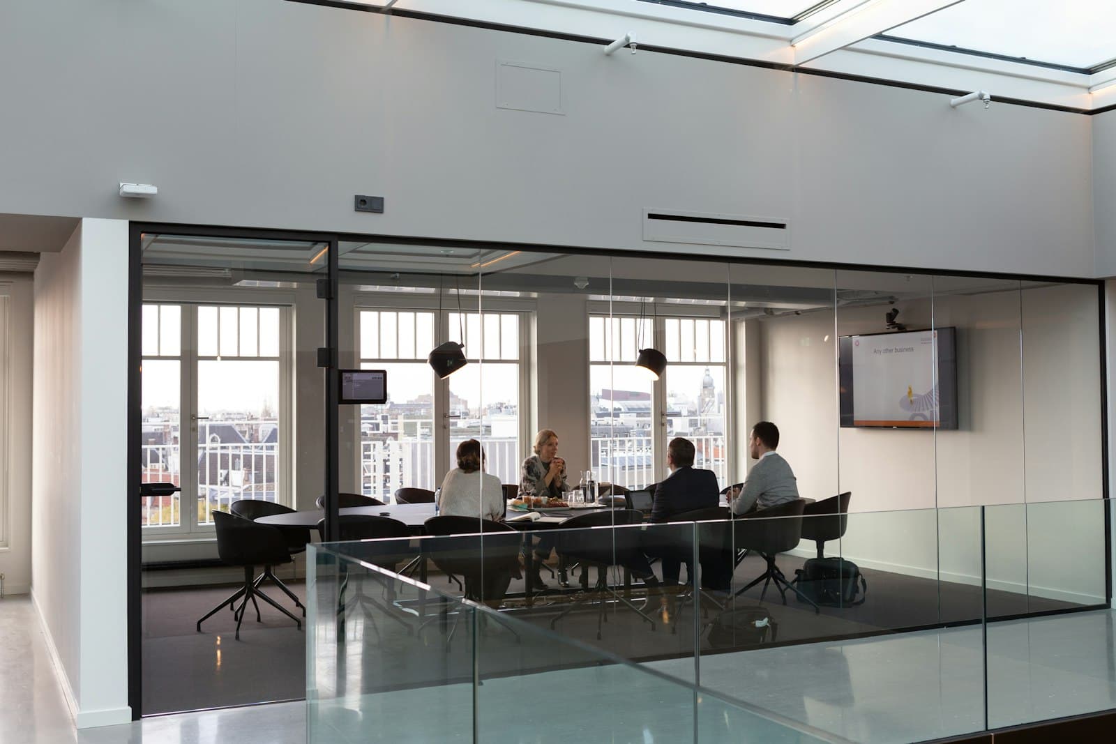 Glass-walled corporate meeting room, representing corporate training and communications voiceover