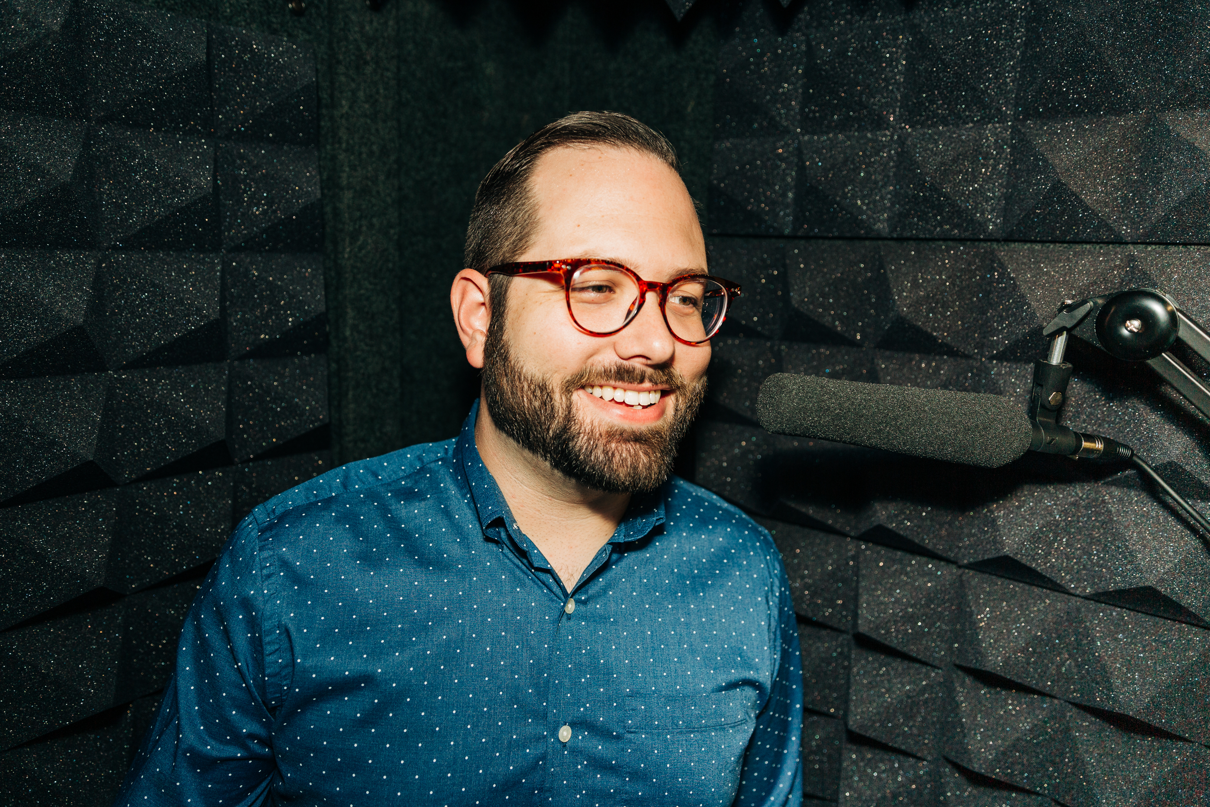 Trevor O'Hare at the microphone in his vocal booth